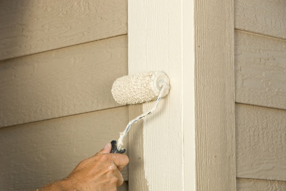 house-painter-rolling-siding-trim-board-184322768-58dbd8533df78c5162134f7f.jpg